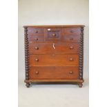 A C19th mahogany Scotch chest of drawers with bobbin turned side columns and four small top