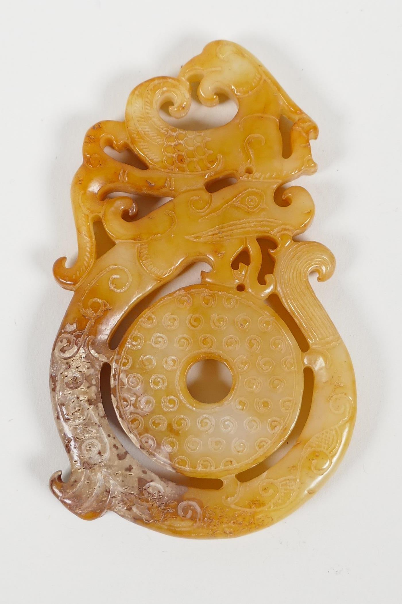 A Chinese carved and pierced hardstone pendant with dragon and phoenix decoration, and another - Image 3 of 5