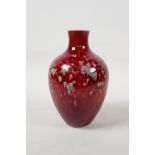 A Chinese porcelain vase with a red and green mottled glaze, six character mark to base, 6½" high"