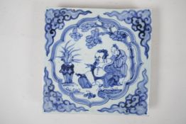 A Ming style blue and white porcelain temple tile with figural decoration, Chinese, 7½" x 7½"