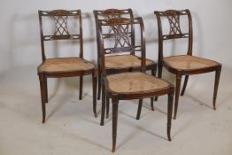 A set of four Sheraton style chairs with pierced backs and Adam style carved decoration, raised on