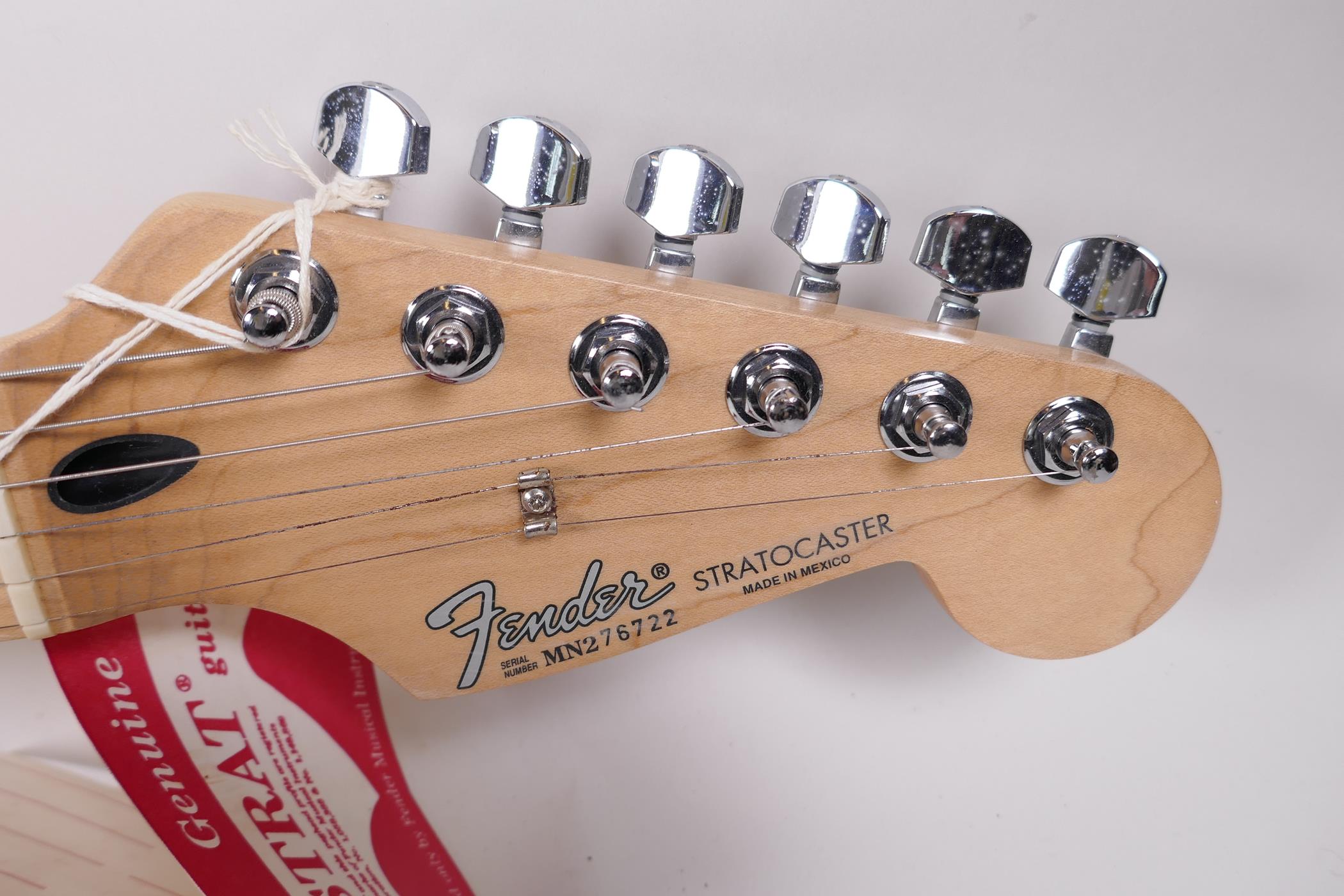 An unused Fender Stratocaster guitar bearing signatures from the band Bon Jovi, 39" long - Image 2 of 6