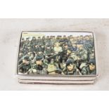 A sterling silver pill box, the cover decorated with a military scene, 2" long