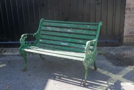 A Victorian painted cast iron two seater garden bench, 41" long