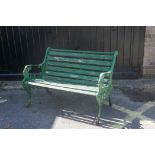 A Victorian painted cast iron two seater garden bench, 41" long