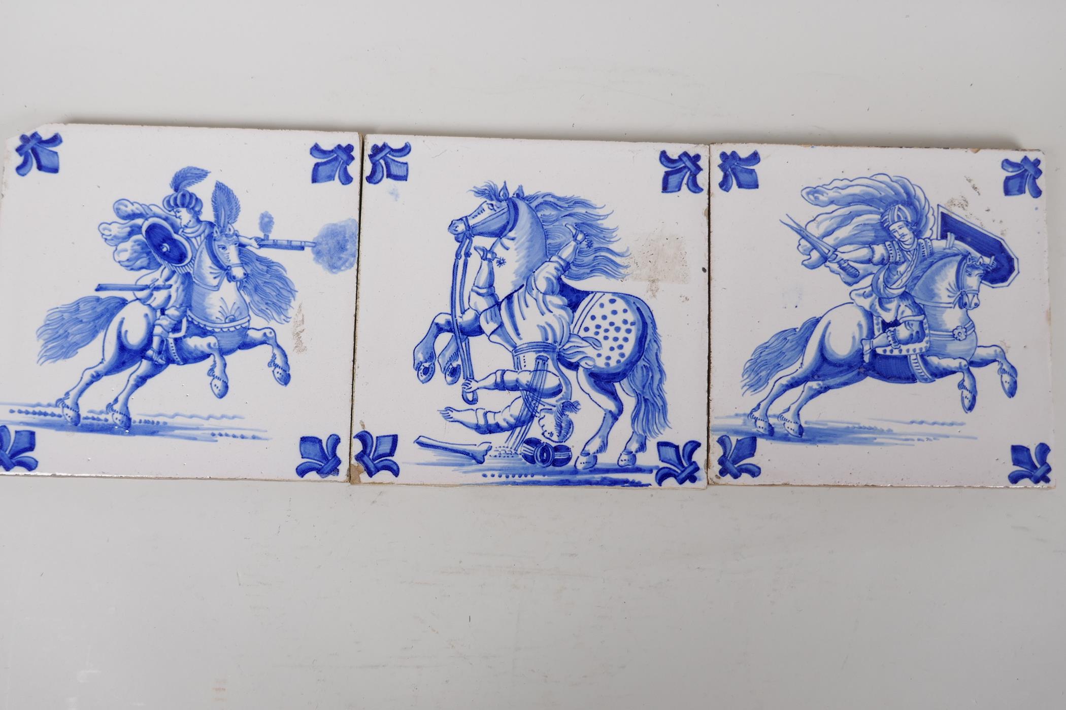 A set of three blue and white Delft style tiles depicting Ottoman warriors on horseback, 6" square