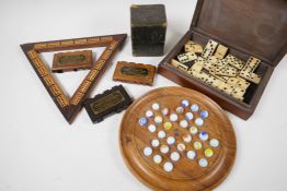 Gaming items: a solitaire board 9" diameter, an early Bezique game, a box of dominoes, a cribbage