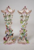 A pair of C19th flower encrusted spill vases, A/F, 10" high