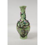 A Chinese polychrome porcelain vase with applied peach tree decoration on a green ground, seal