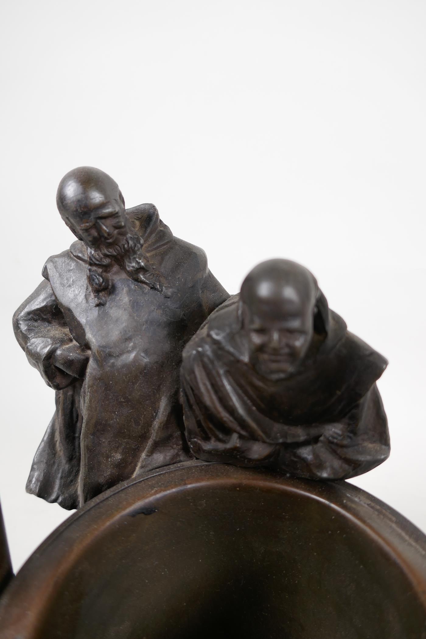 A bronze stand cast as two classical figures looking into a well, 10" diameter, 11" high - Image 3 of 6