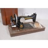 A Frister & Rossman antique sewing machine in case, 21" x 13" x 10"