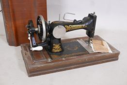 A Frister & Rossman antique sewing machine in case, 21" x 13" x 10"