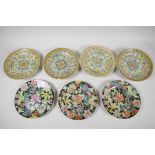 Four late C19th Chinese porcelain plates decorated with symbols, on a yellow ground, 7" diameter,