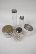 Four glass dressing table jars with hallmarked silver covers, together with a perfume decanter