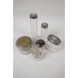 Four glass dressing table jars with hallmarked silver covers, together with a perfume decanter