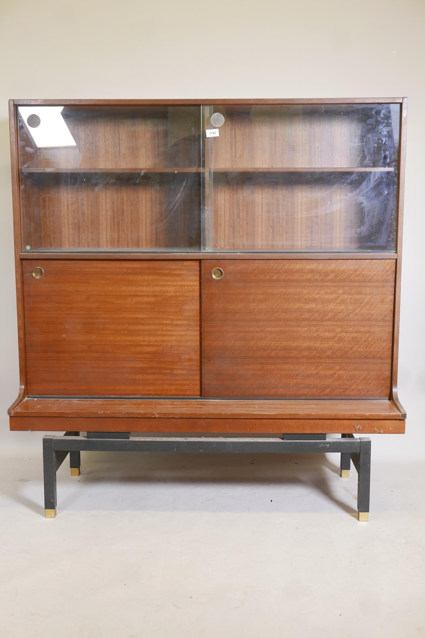 E. Gomme, G Plan mid century mahogany side cabinet with sliding doors and ebonised base, 48" x 18" x