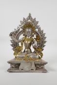 A Sino Tibetan white metal figure of a seated deity carrying a sword with gilt highlights, double