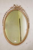 A Victorian giltwood and composition Adam style wall mirror with moulded harebell decoration