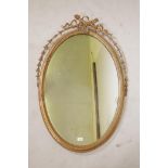 A Victorian giltwood and composition Adam style wall mirror with moulded harebell decoration