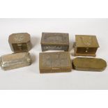 Six brass trinket boxes including embossed and musical, largest 5" long