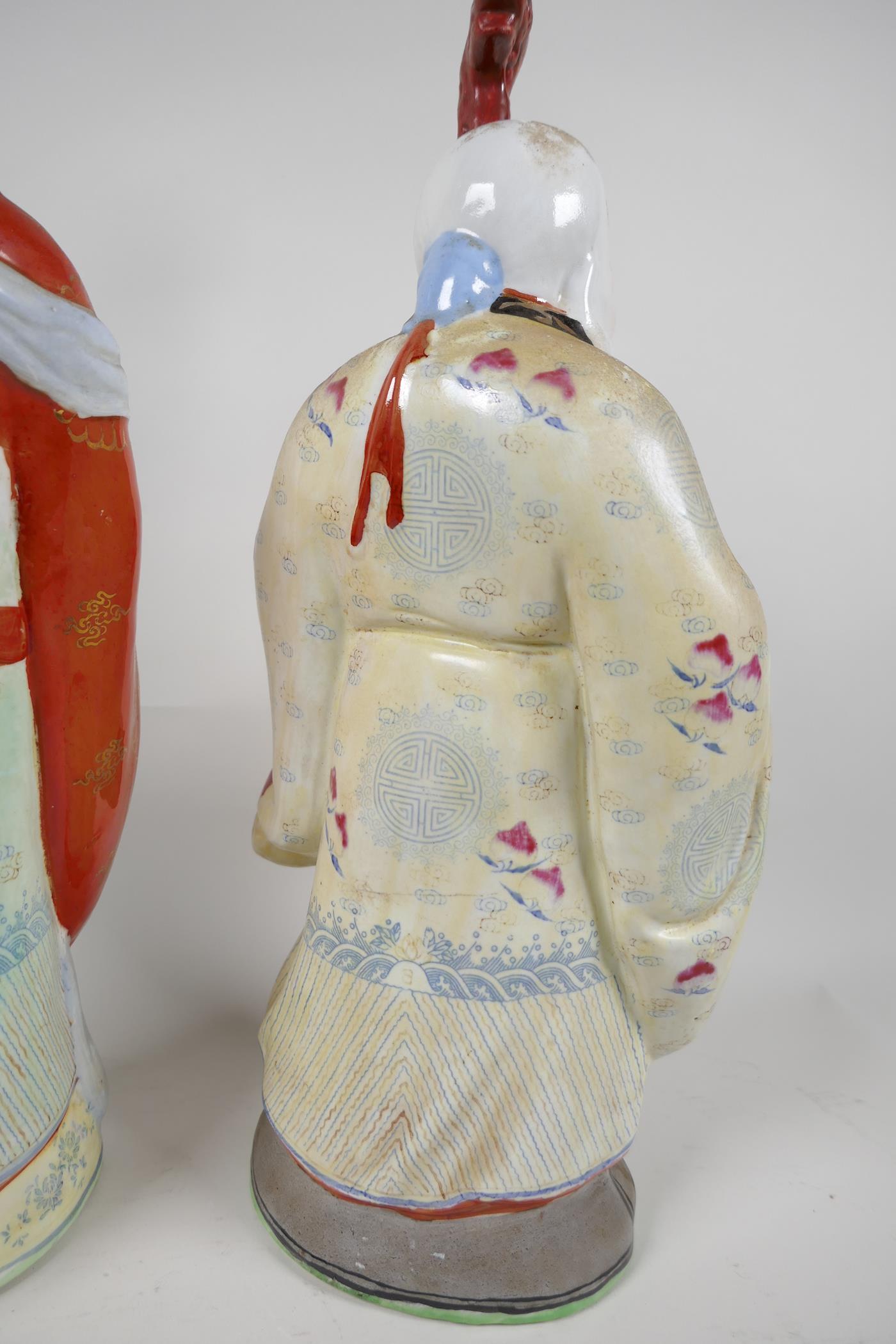 A Chinese porcelain figure of a dignitary with a bejewelled ruyi, painted in bright enamels, 15" - Image 6 of 7