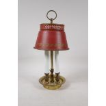 A brass three light lamp with toleware shade, 14" high