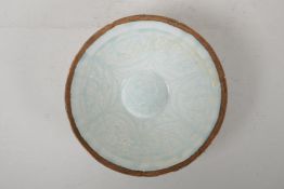 A Song style celadon glazed porcelain conical bowl with underglaze phoenix and floral decoration,