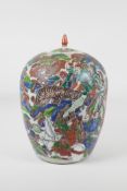 A Chinese famille vert porcelain ginger jar and cover, decorated with a tiger hunting scene. 12"