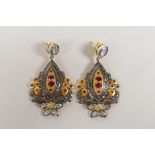 A pair of silver gilt drop earrings set with uncut diamonds and rubies, 2" drop