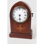 An inlaid mahogany cased lancet mantel clock with enamelled dial and Roman numerals, 8" high