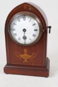 An inlaid mahogany cased lancet mantel clock with enamelled dial and Roman numerals, 8" high