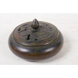 A bronze censer with pierced cover, 4" diameter