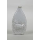A Chinese hard paste snuff bottle with moulded cockerel decoration, impressed seal mark to base,