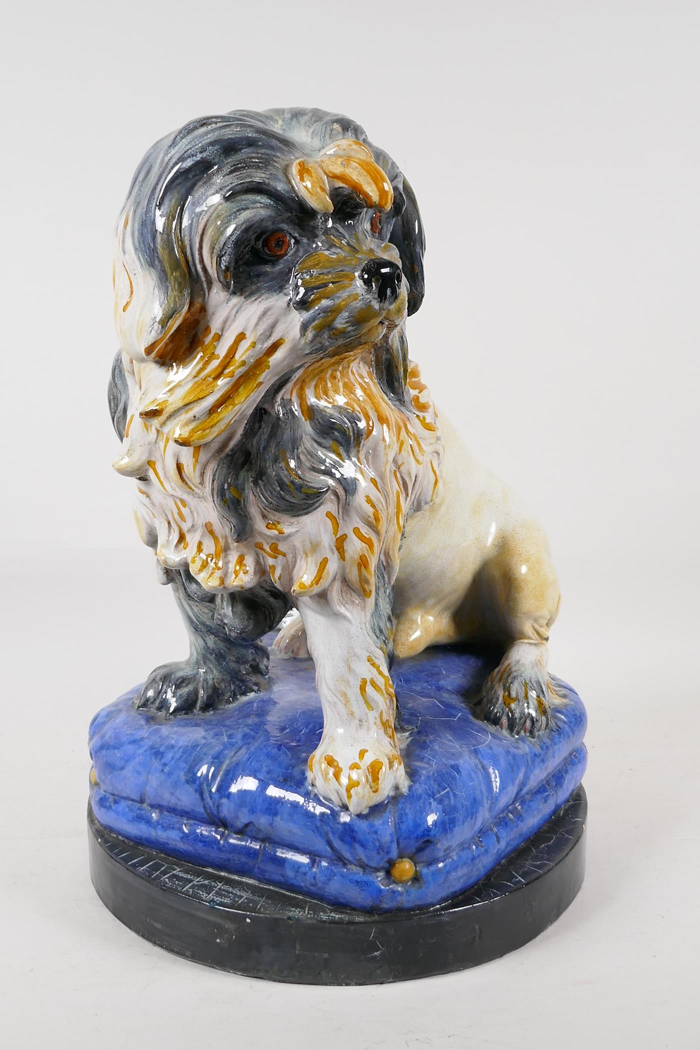 A Majolica pottery dog on a blue pillow, 16" high - Image 3 of 5