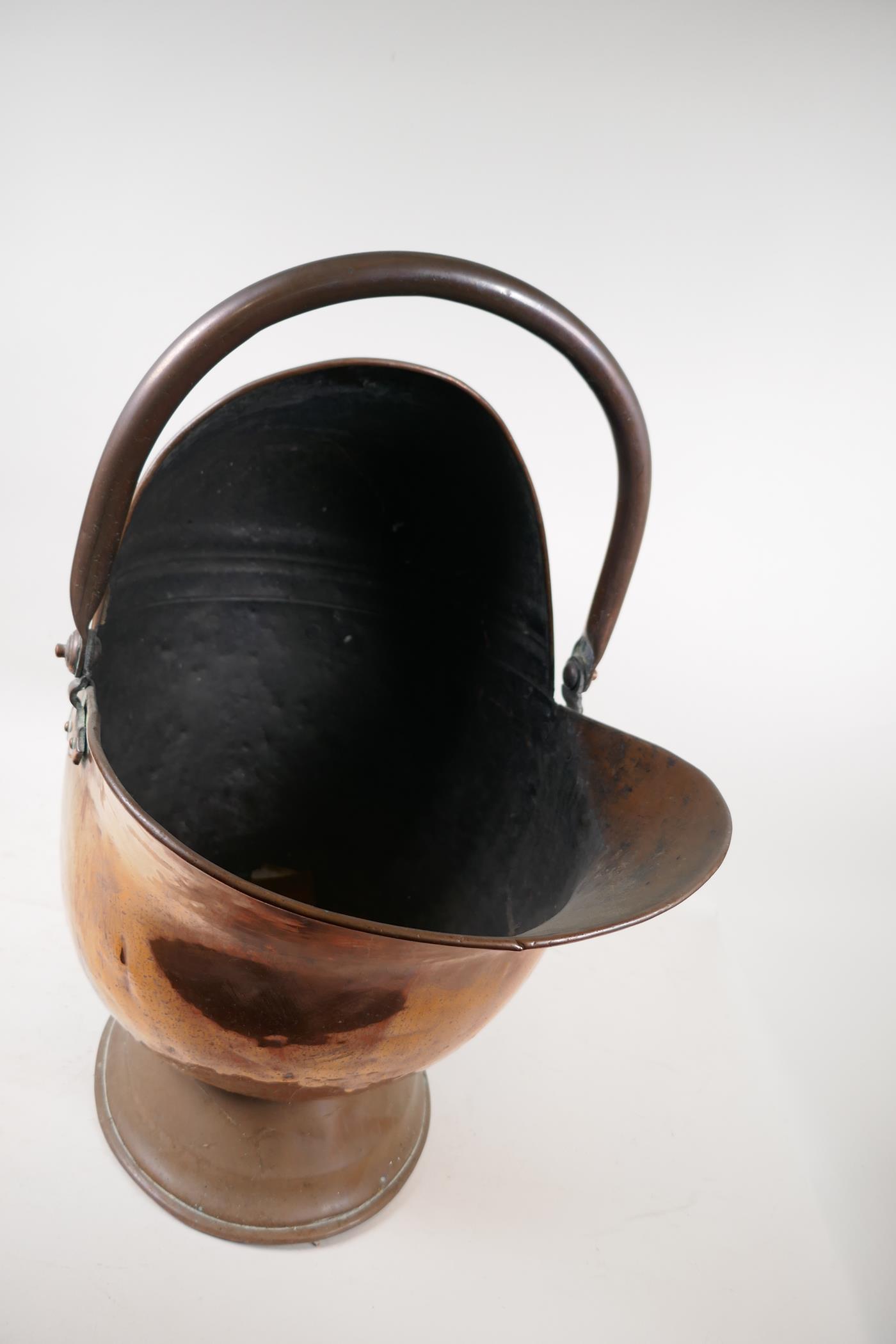 A helmet shaped copper coal scuttle, 21" high - Image 4 of 4