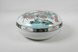 A Chinese famille vert porcelain box and cover, decorated with women and deer in a landscape, 11½"