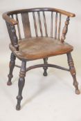 A C19th ash and elm seated bow arm chair, with crinoline stretcher and turned supports (originally a