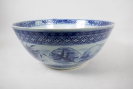 A blue and white punch bowl painted with flowers, birds, fish and characters, Kangxi Chinese mark to