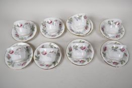 A set of eight Paragon 'Bridal Rose' pattern coffee cups and saucers