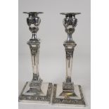 A pair of square section classical style silver plated candlesticks, 11" high