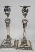 A pair of square section classical style silver plated candlesticks, 11" high