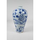 A Chinese blue and white porcelain Meiping vase decorated with a phoenix, flowers and fruiting