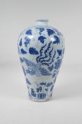 A Chinese blue and white porcelain Meiping vase decorated with a phoenix, flowers and fruiting