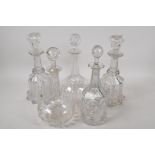 Five C19th glass decanters, 11" high