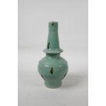 A Chinese green glazed porcelain vase with brown drip glaze detail, 8½" high