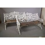 A pair of mid C20th painted cast aluminium garden benches in the Coalbrookdale style, by repute cast