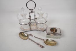 A silver plate and glass oil and vinegar cruet set, 9" high, together with a pair of silver plate