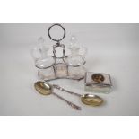 A silver plate and glass oil and vinegar cruet set, 9" high, together with a pair of silver plate