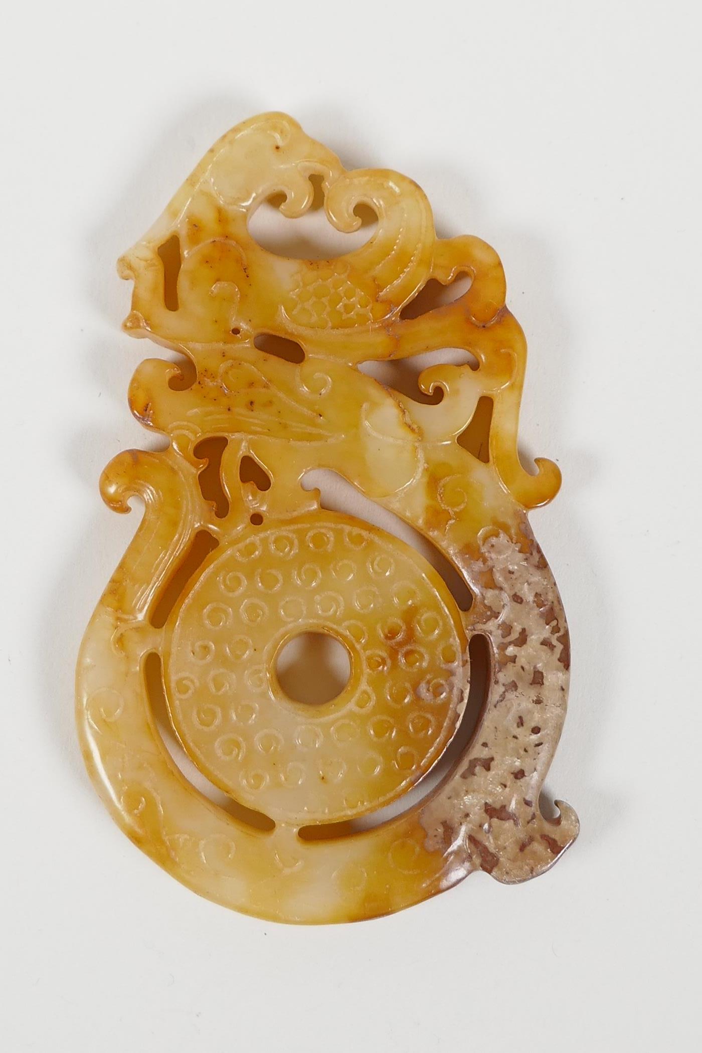 A Chinese carved and pierced hardstone pendant with dragon and phoenix decoration, and another - Image 2 of 5