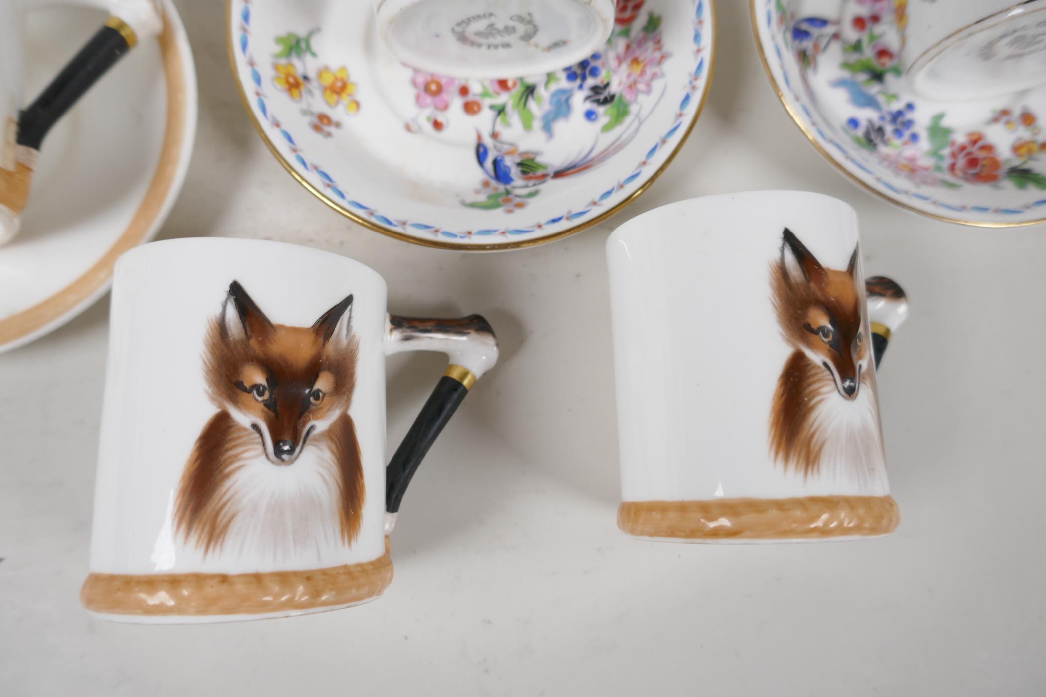 Four Royal Doulton coffee cans embossed and painted with fox heads, and two saucers, together with - Image 4 of 5